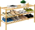 Natural 3 tier long bamboo shoe rack with two rows of shoes and a plant on top