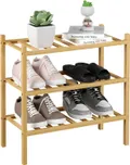 Natural 3 tier small bamboo shoe rack with sneakers on each shelf and a plant on top