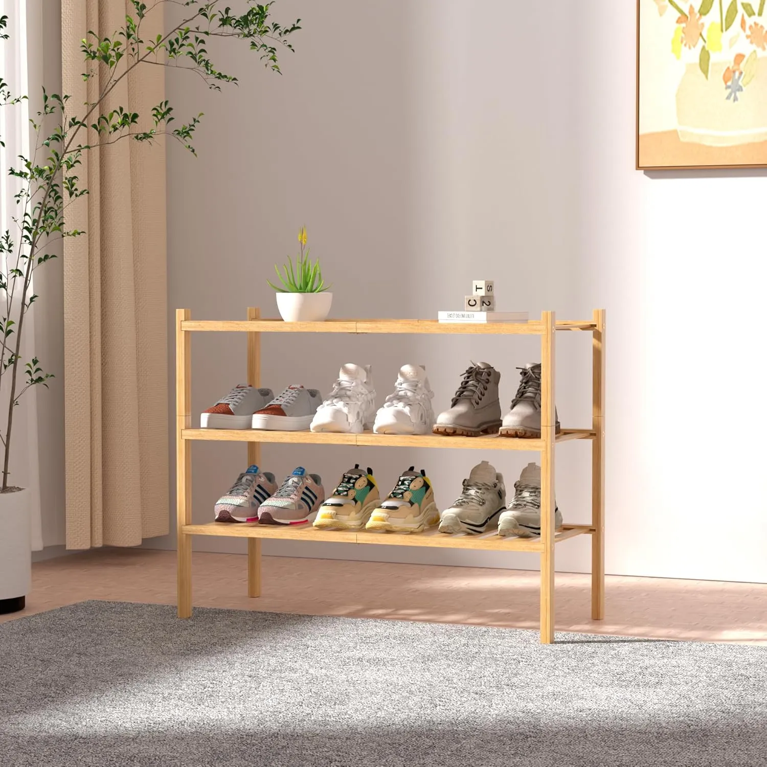 Natural 3 tier shoe rack against a hallway wall holding sneakers and boots